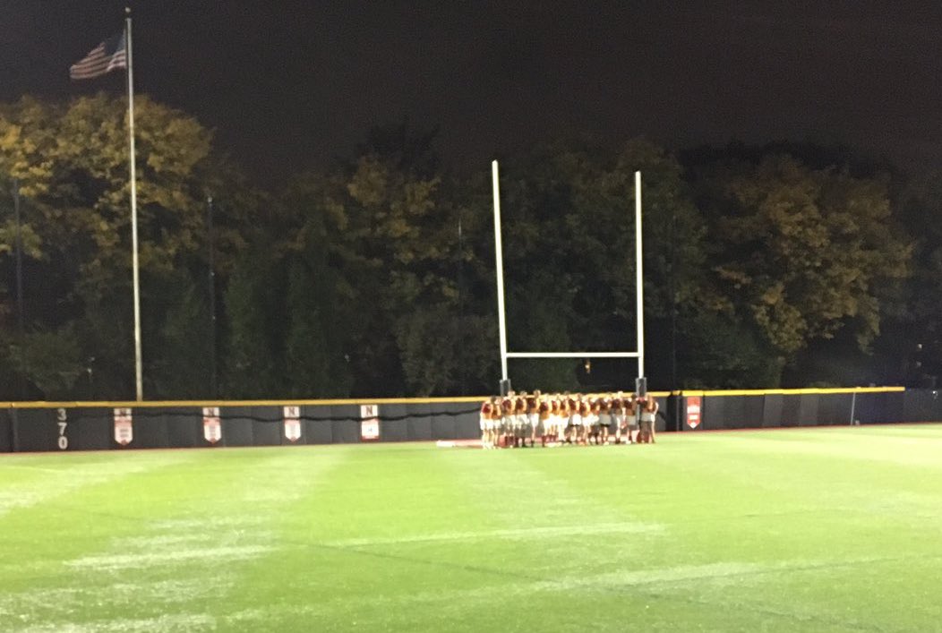 Boston College rugby team huddles up after a game in the fall of 2016.