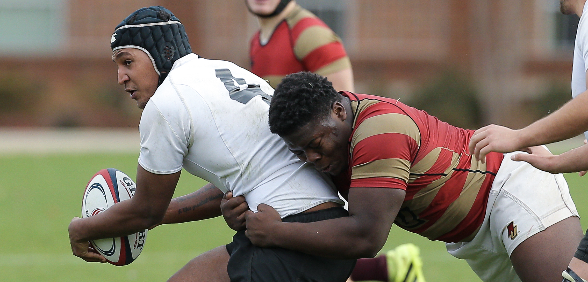 Keyon McCloud-Holman of Norwich tackles Zachary Smith of Wisconsin-Whitewater in the semifinals of the 2016 national DII college rugby championship. Jeremy Fleming photo.