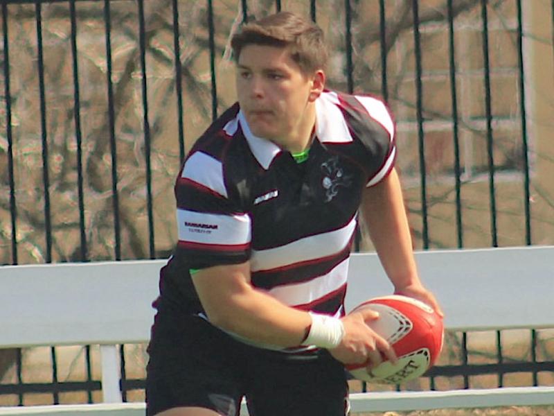 Jacob Ortiz passes the ball out for the Benedictine Black Monks.