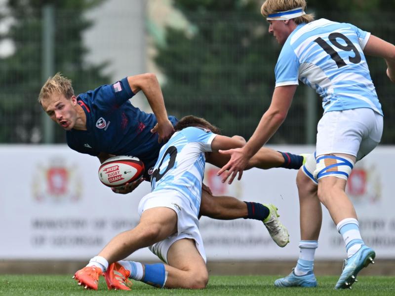 Gavin Holder gets some attention from the Argentina U20 defenders. Photo Levan Verdzeuli for World Rugby.