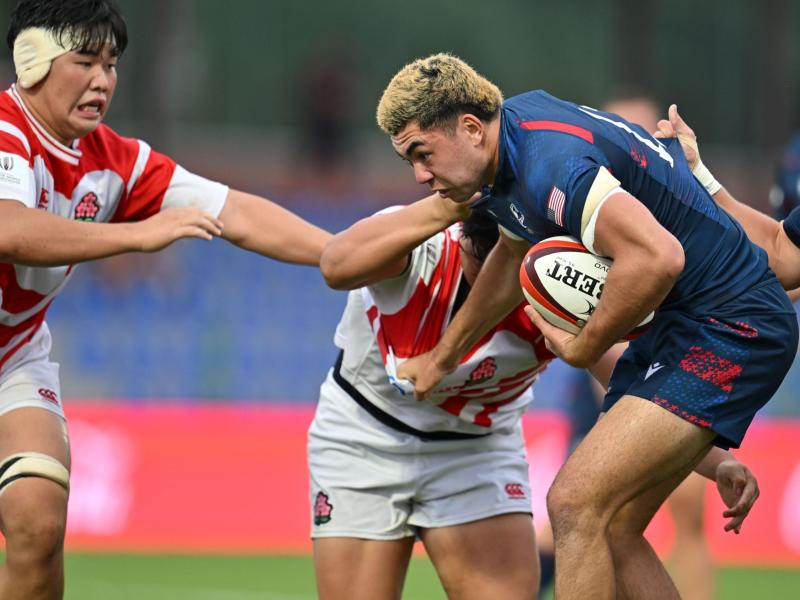 Dane Mitchell works his way through the Japan defense. Photo Levan Verzeuli for World Rugby.