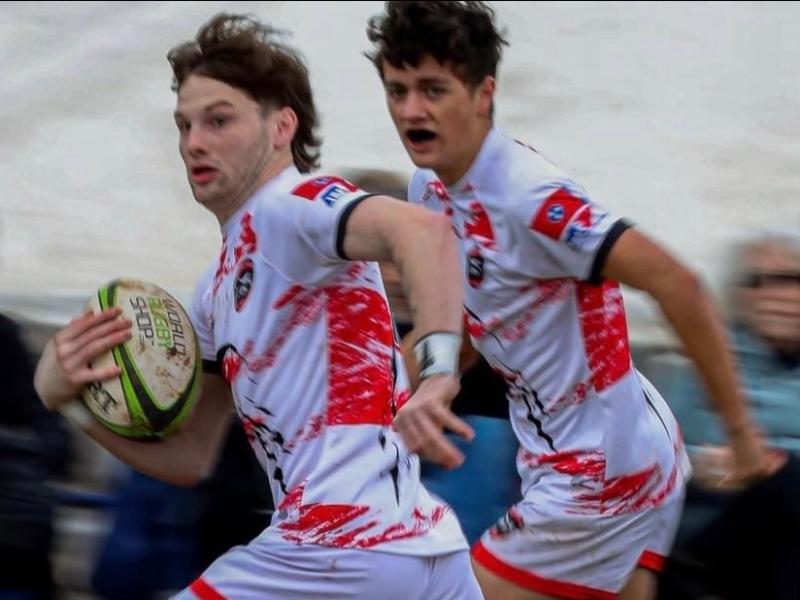 Senior fullback Wyatt Appleton with senior wing Ty Lavender in support.