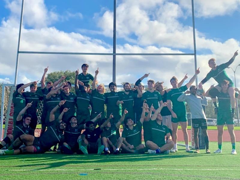 USF players with the "Gozilla!" pose after beating FAU.