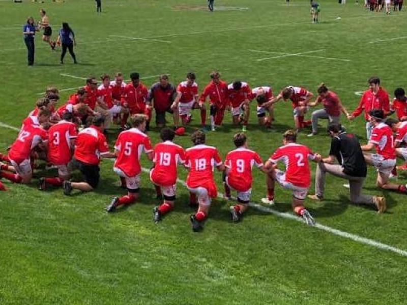 regis jesuit kneels