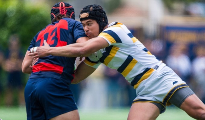 Two players on the West: Rand Santos tackles Dom Besag. Photo David Barpal.