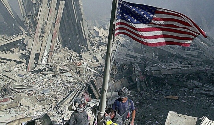 Flag raised at the site of the attacks by rugby-playing firefighters.