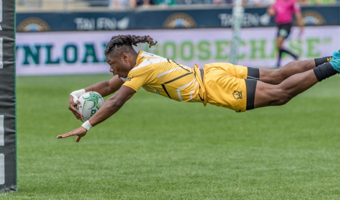 Royaal Jones of AIC soars in for a try during the 2017 CRC in Chester, Pa. Colleen McCloskey photo.