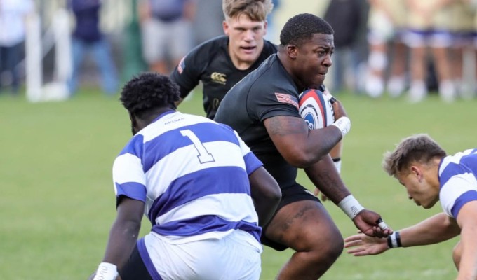 Larry Williams powers on against Queens. Photo Army Rugby.