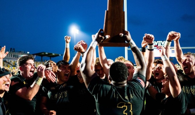 Larry Williams raises the D1A Championship trophy.