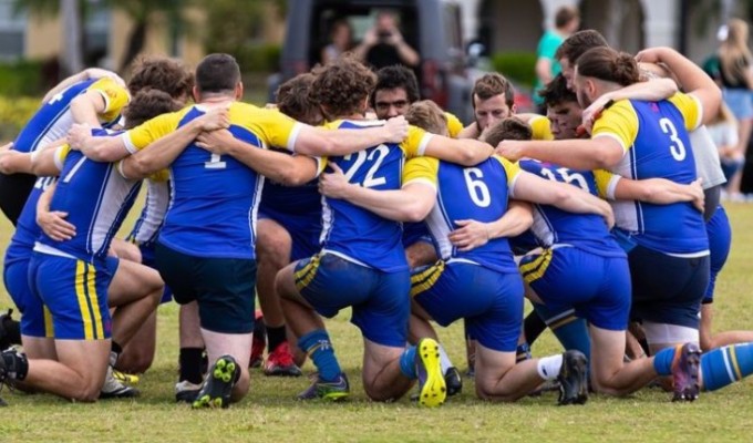 Ave Marian club huddles up. They will be operating under the Athletic Department starting next fall.