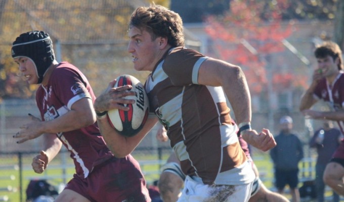 Antonio Esteves charges ahead for Brown.