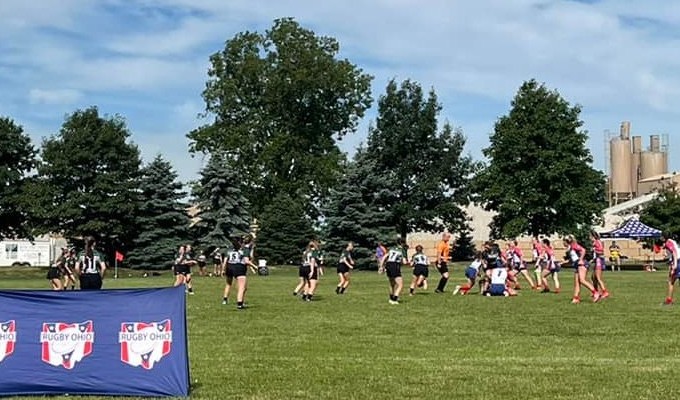 The girls in action under blue skies.