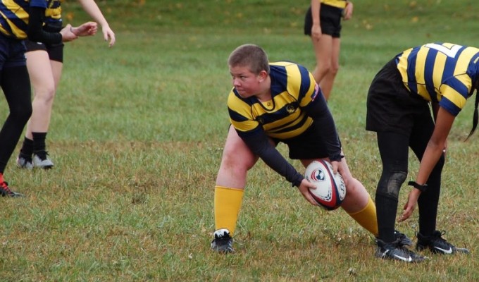 Cassidy Phillips sends the ball out after a "tackle". Carmel HS Rugby photo.