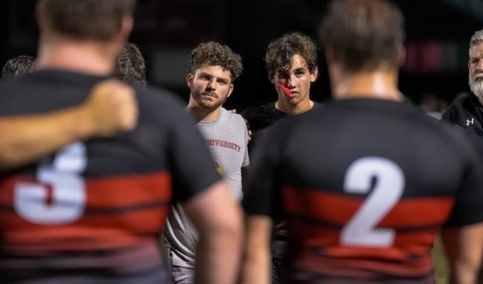 Catholic University players huddle up this past season.