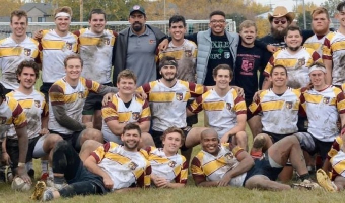 Central Michigan, muddy, tired, and smiling.