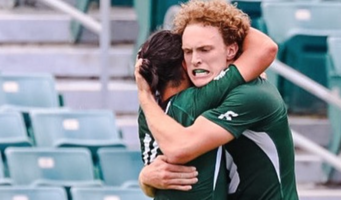 Frohlich and Weir hug it out. Photo NCR.