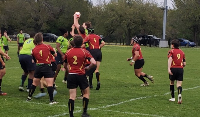 Bayous in green and Brother Martin in red compete for the lineout ball.