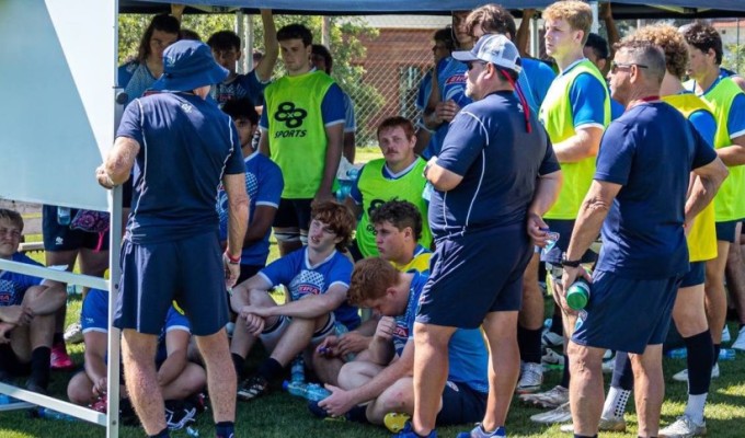 The EIRA players and coaches during game prep this week.