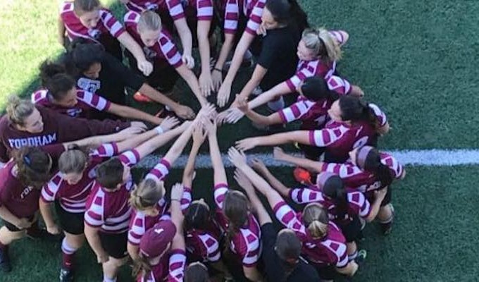 Fordham women huddle.