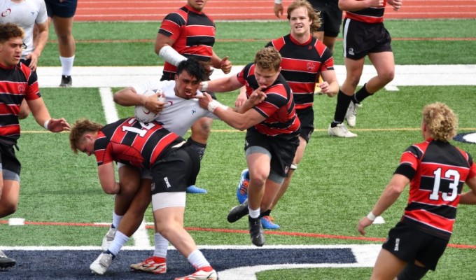 United's defense swarms Manaia Brown. Travis Watson photo.