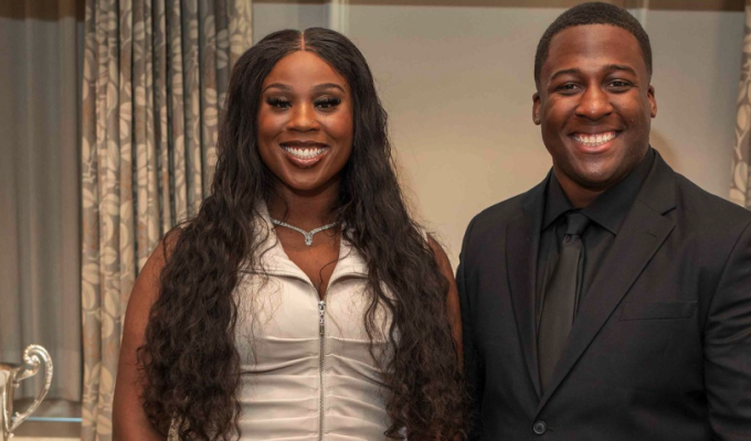 Idia Ihensekhien and Larry Williams received their trophies on Saturday in Seattle. John Bang photo for WAC.