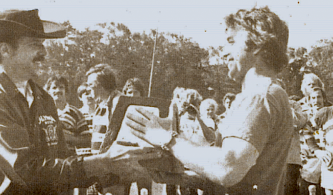 Jerry Walter accepts the trophy for the BATS winning the 1975 Golden Gate tournament. Photo Rugby Magazine.