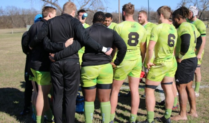 Life players huddle up. Alex Goff photo.