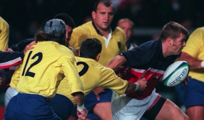 Mark Scharrenberg garners some attention against Romania in the 1999 Rugby World Cup. Photo INPHO