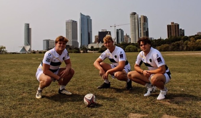 Marquette's leadership poses in front of the Milwaukee skyline.