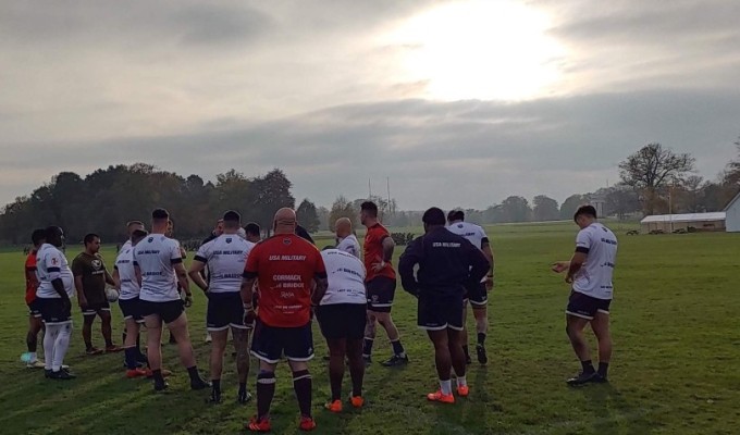 Such a pretty picture. The forwards huddle up on one of Sandhurst's rugby fields. Alex Goff photo.