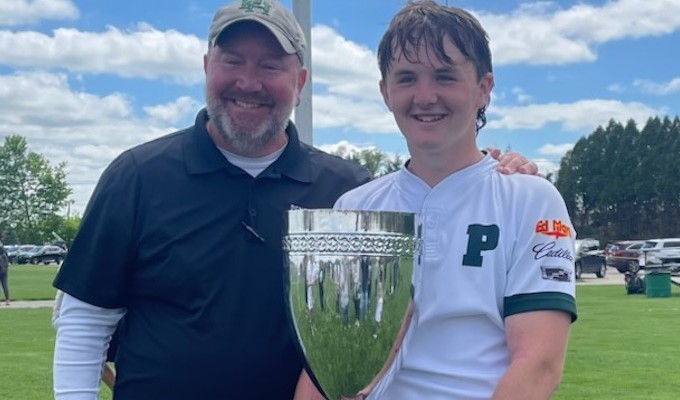 Head Coach Curt Trout and captain Nick Trout with the trophy.