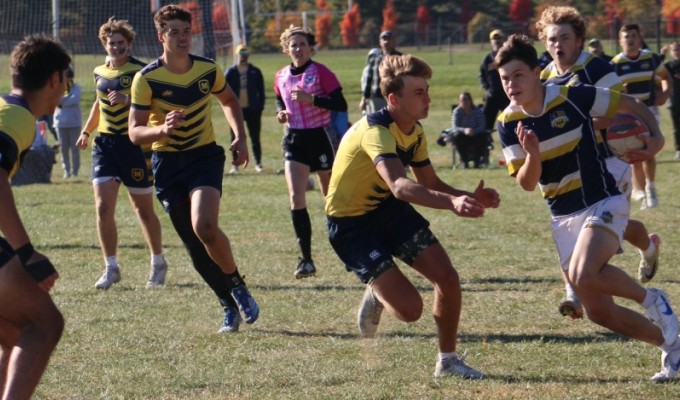 Mark French takes a gap vs Moeller. Alex Goff photo.