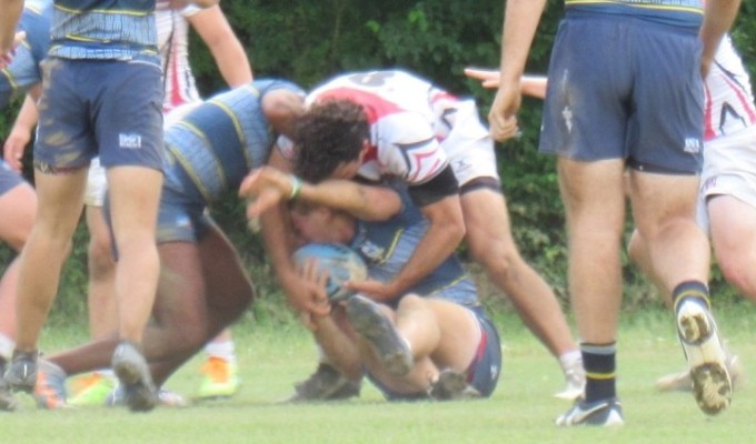 Game MVP Max Orefice is on the ball at the tackle, forcing a penalty.