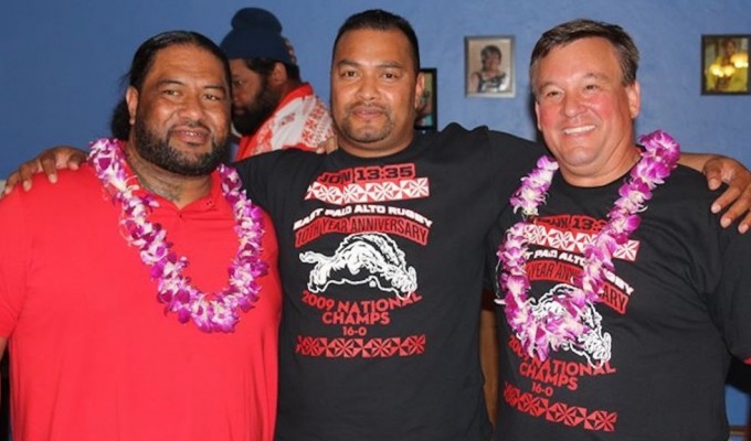 Rob Holder at right celebrating an undefeated season for East Palo Alto.