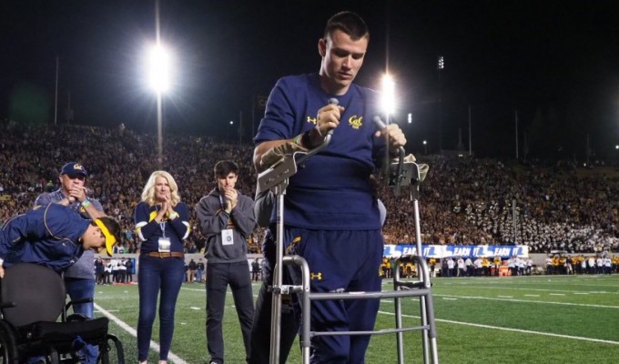 Robert Paylor walking with the aid of a walker at the Cal football game.