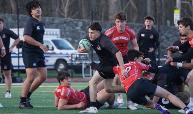 Rye's Harry Hillis carries the rock vs Greenwich. Photo Will Kressler.