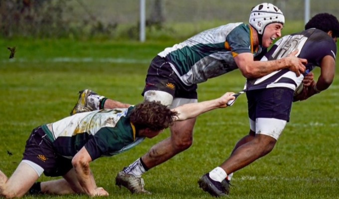 Gavin Maguire making a tackle for SFGG. Photo Shot by 2 Active.