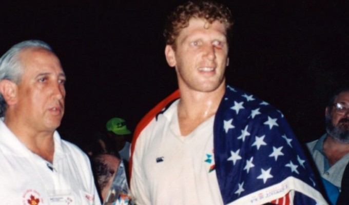 Shawn Lipman wrapped in the USA flag and receiving the 1997 Maccabiah Games rugby trophy.