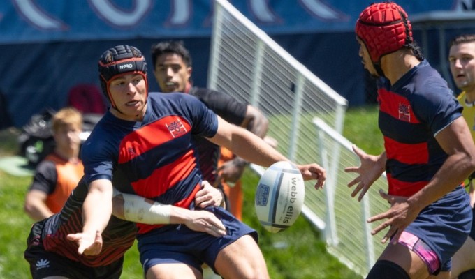 Dom Besag offloads to Sosaia Pongi. Photo Rebecca Harper, Saint Mary's Rec Sports.