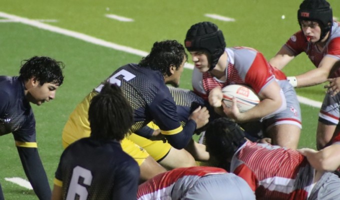 St. Thomas in red vs FFA. Benjamin Kinsel photo.