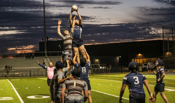 Pretty sunset for an earlier game Aquinas vs St. Martin's. Griff Hastings photo.