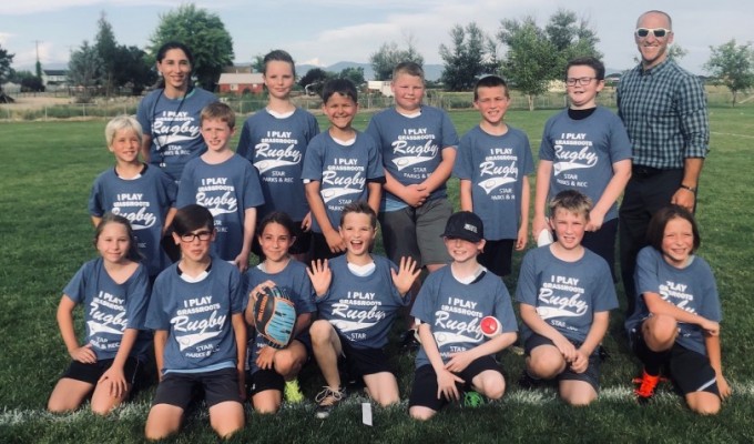 Nifty new T-shirts and some rugby in the sunshine get the kids smiling.