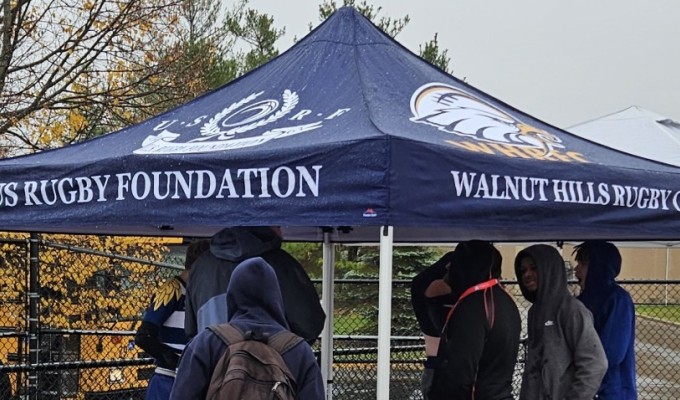 Previous tent recipients Walnut Hills getting shelter against the Ohio rain. Photo Alex Goff.