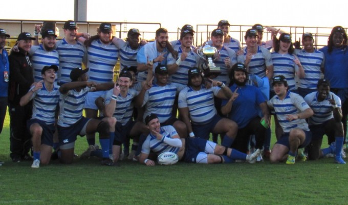 Thomas More players with that pretty trophy. Alex Goff photo.