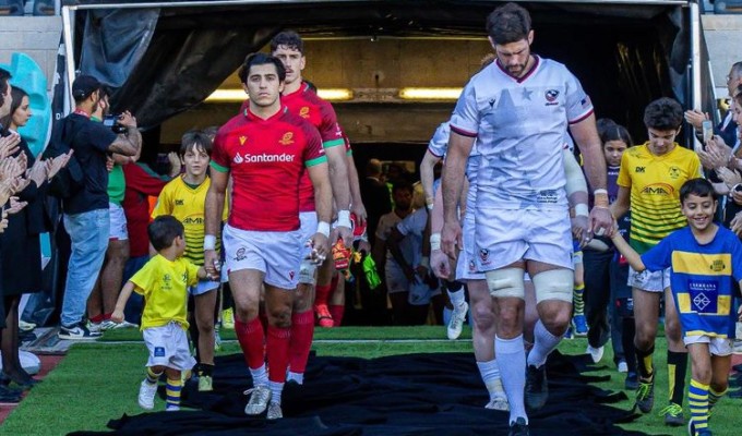 Tomas Appleton over Portugal and Greg Peterson of USA lead their respective teams out.