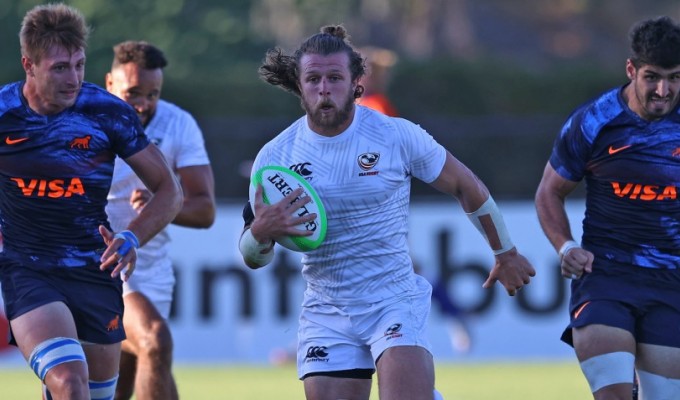 Stephen Tomasin is chased by Pumas. Travis Prior photo.