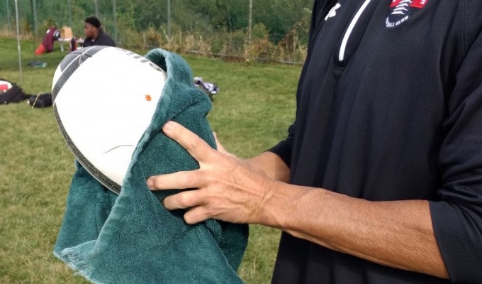 Keeping the rugby balls clean. Alex Goff photo.