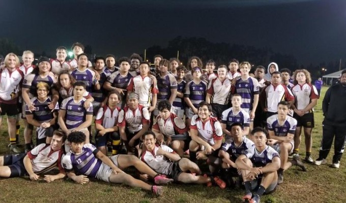 Wilson and Saint Anthony's players pose together after the game.