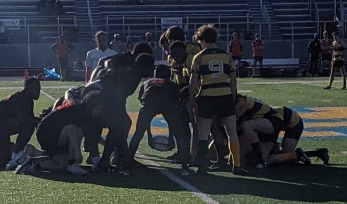 Withrow (black and red) scrums down against Walnut Hills.