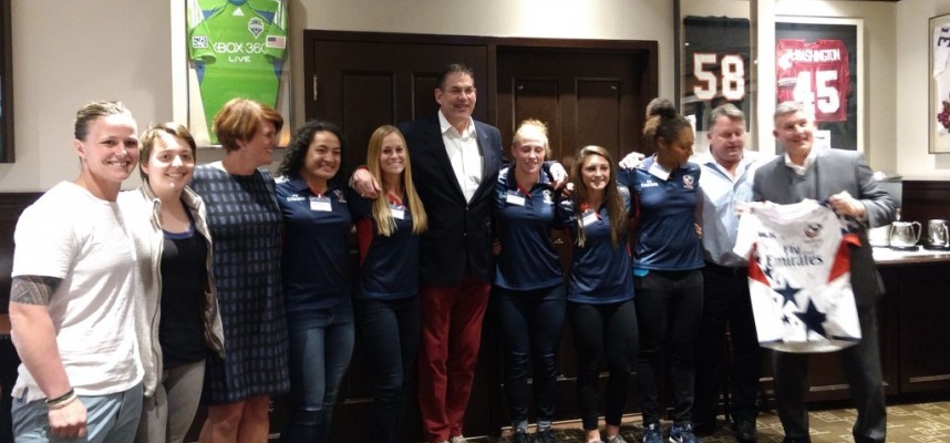 The Falcons players pose with former Eagle Tony Ridnell (at center), Juli Prentice (3rd from left), and Chris Prentice (2nd from right) from Atavus, and Wayne Milner of the WAC (at right).